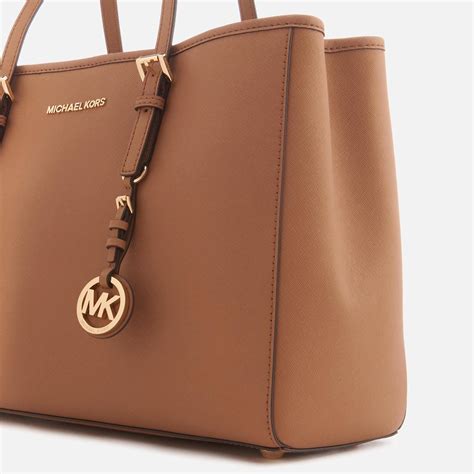 michael michael kors jet set travel large leather tote bag|Michael Kors bag with airplanes.